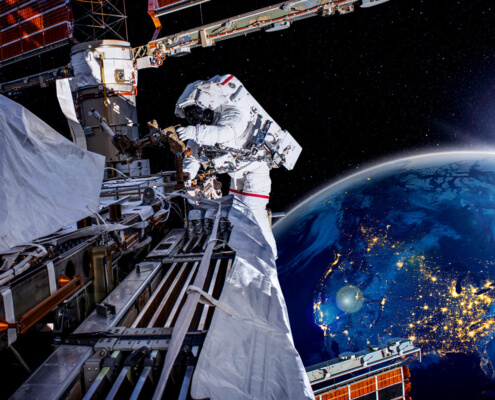 astronaut in space, the Earth in the background