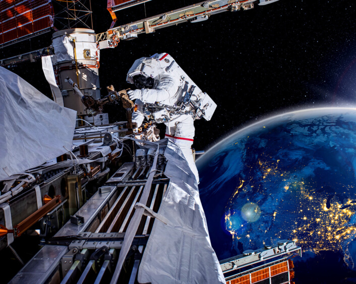astronaut in space, the Earth in the background