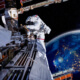 astronaut in space, the Earth in the background